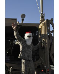 A soldier plays Santa at the Kuwaiti border crossing