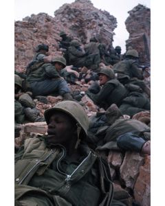 Marines scale a mound of rubble in the Citadel, 1968